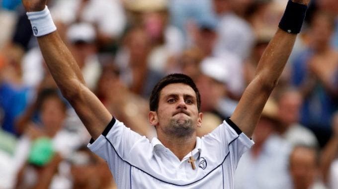 Novak Djokovic esulta dopo aver battuto Federer nella semifinale degli US Open 2011 (Photo by Mike Stobe/Getty Images)