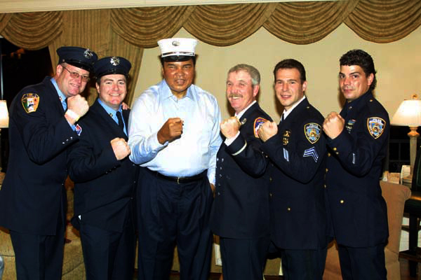 Delray Beach, Florida 2001/10/25 Muhammad Ali with members of the NYPD and NYFD at Bob Beamon Golf & Tennis Classic. Photo by Art Seitz