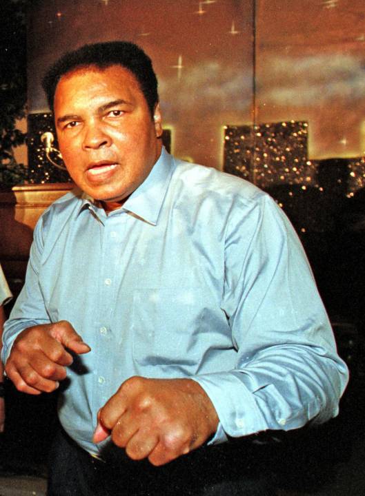 Delray Beach, Florida, USA 2001/10/25 BIG FISTS/FAST HANDS During the Bob Beamon Golf & Tennis Classic AN EVENING WITH GREATNESS, Muhammad Ali-the Greatest Athlete to ever live and most recognized person on the planted, quipped that he was" planning a comeback". Ali's sense of distrance is certainly entact, as his fists were only inches from photographer Art Seitz's Canon 17-35mm zoom lnches, when he took this photo.
